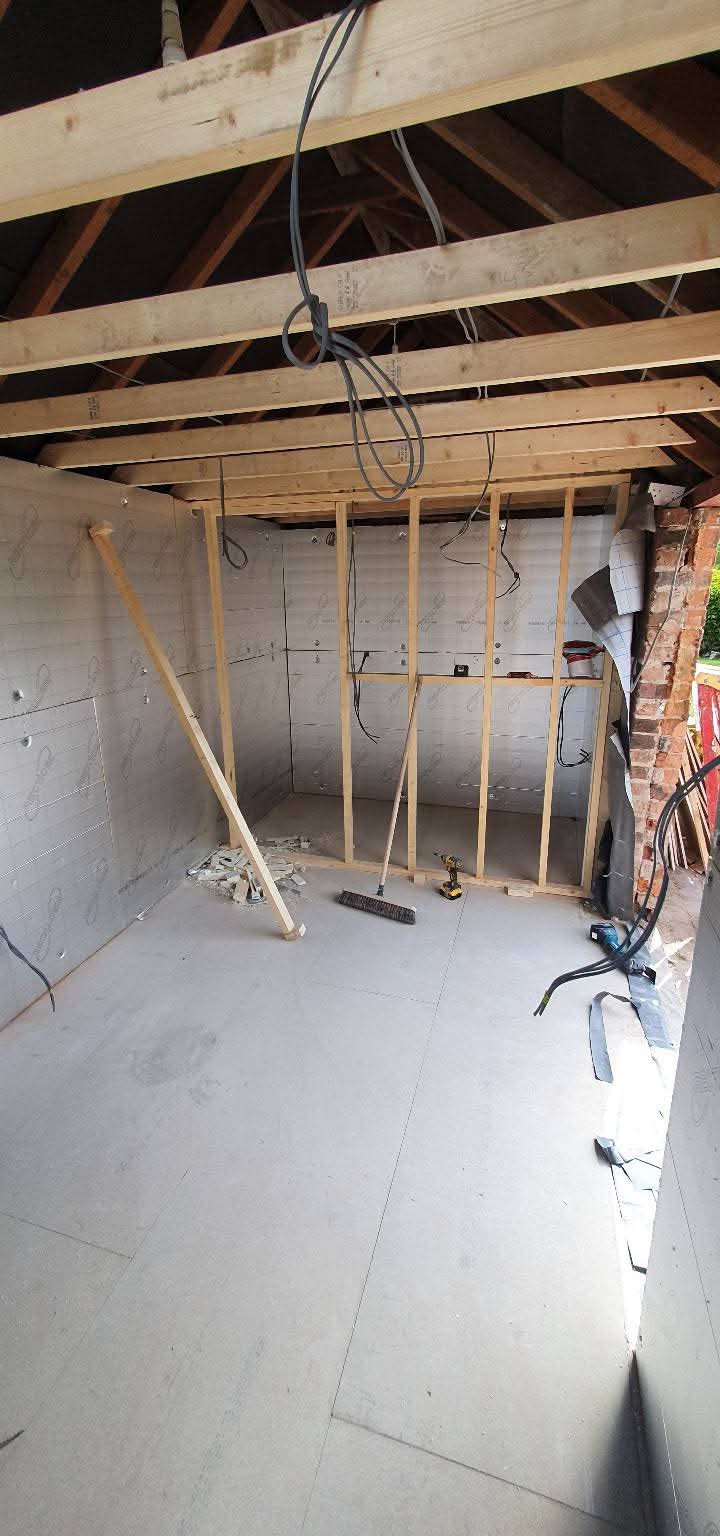 Garage interior with roof timbers and insulation