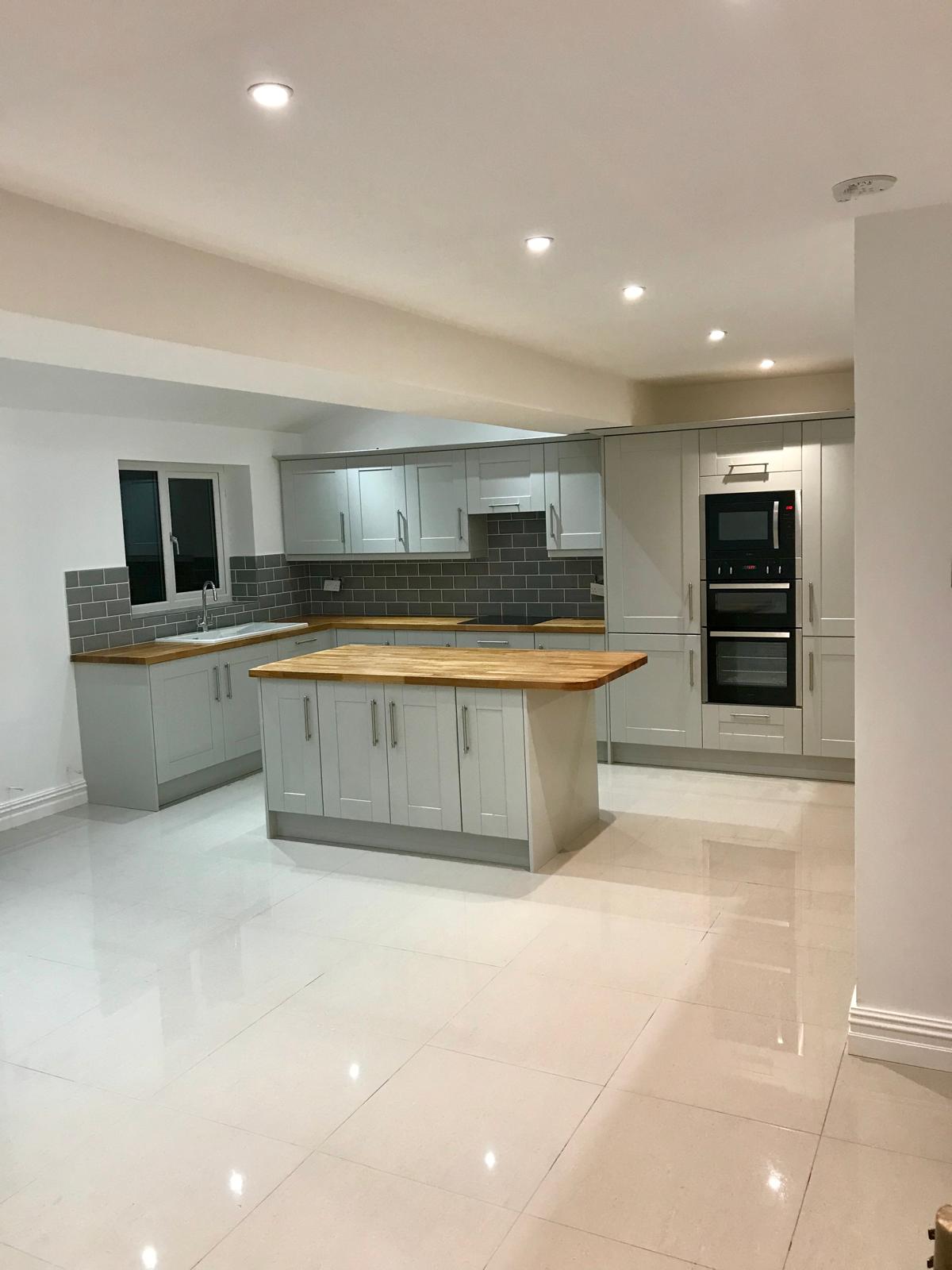 Finished Romiley kitchen extension with fitted cabinets and island