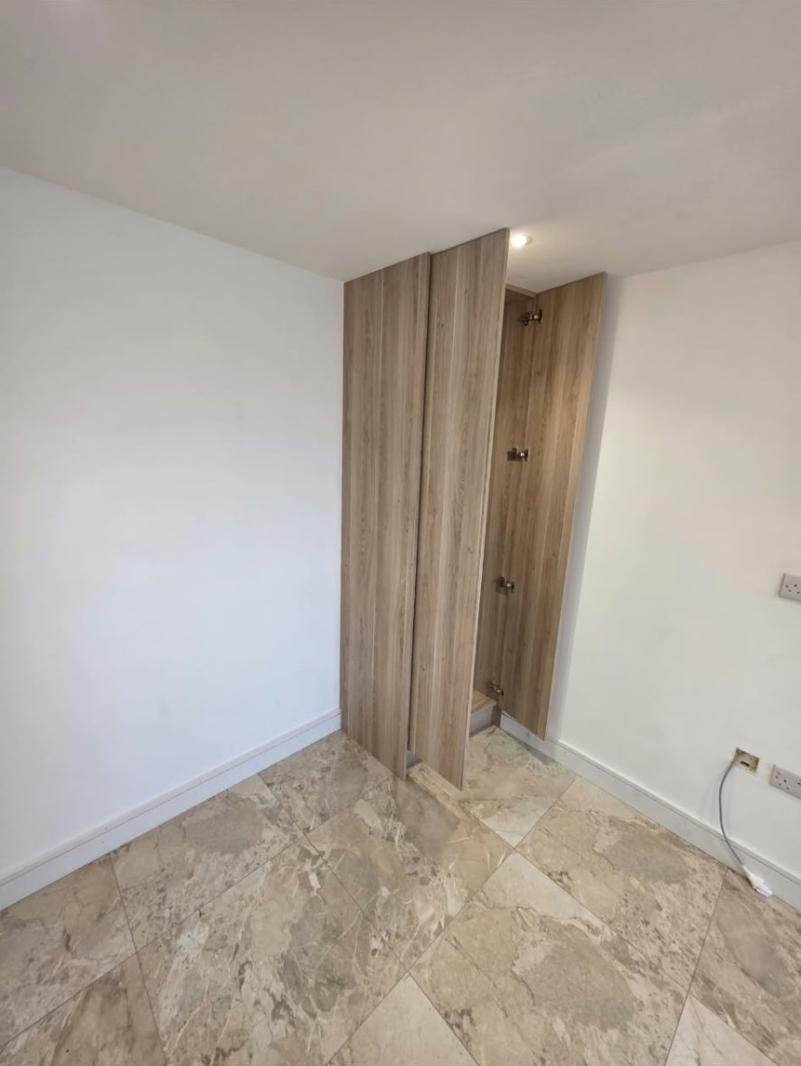 Fitted tall cupboard in the Worsley home office