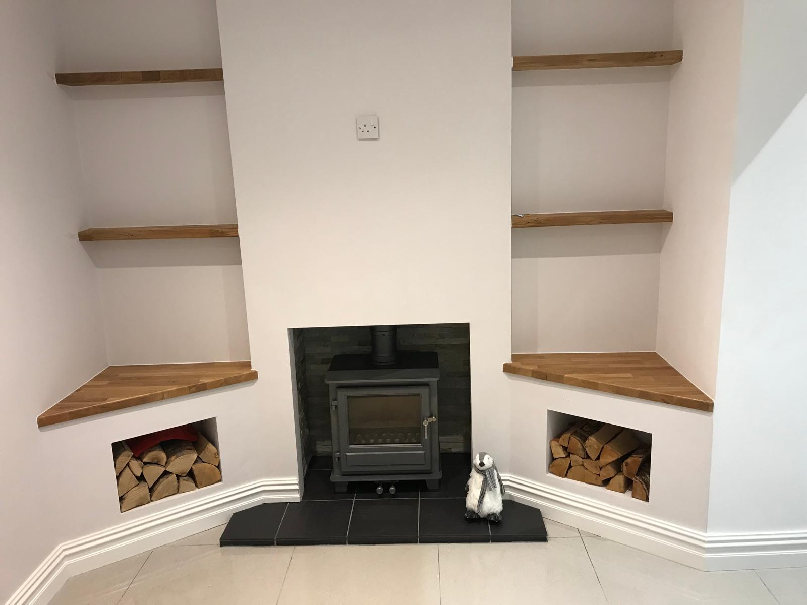 Fireplace and built-in shelving in the Romiley kitchen extension