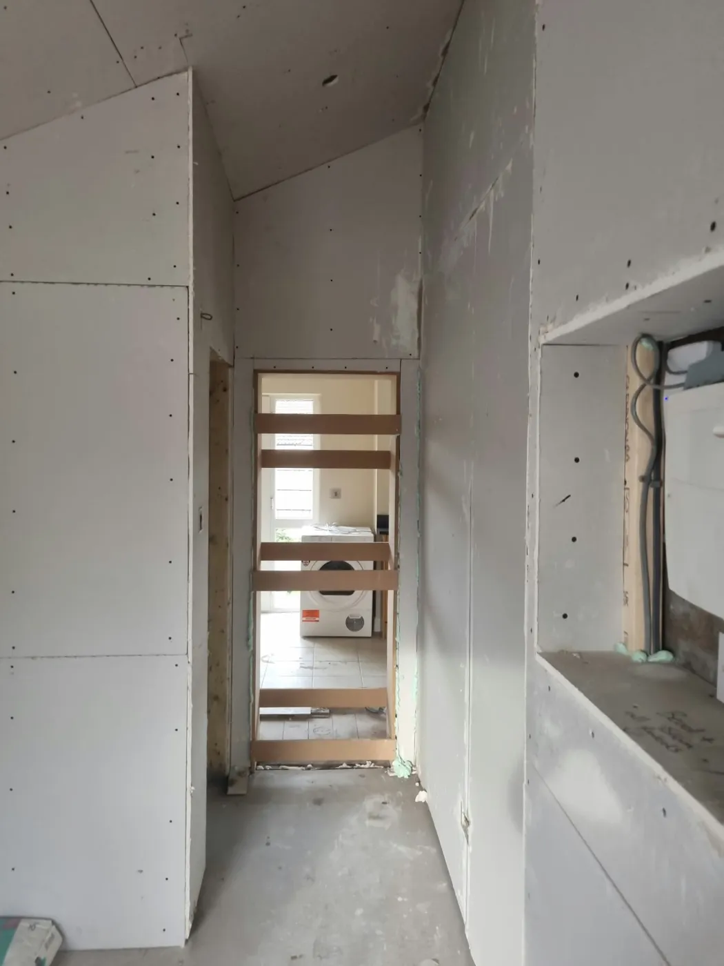 Plasterboarded internal walls and new doorway prepared for plastering in the Marple conversion