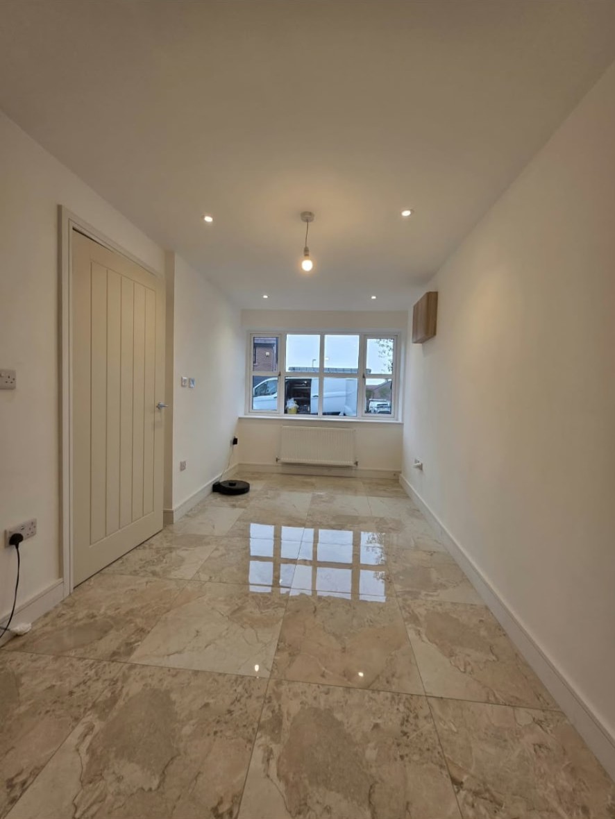 Finished home office in Worsley with tiled floor, spotlights and front window