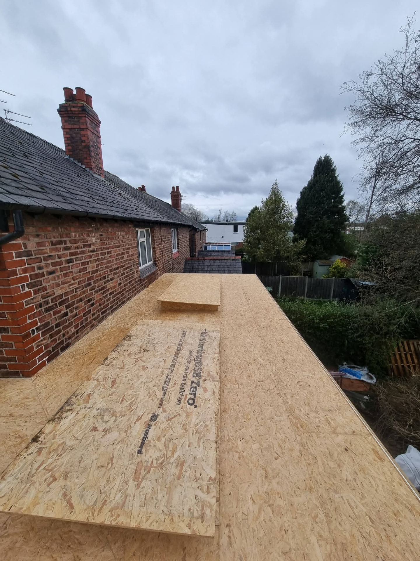 New timber roof decking with raised rooflight kerbs