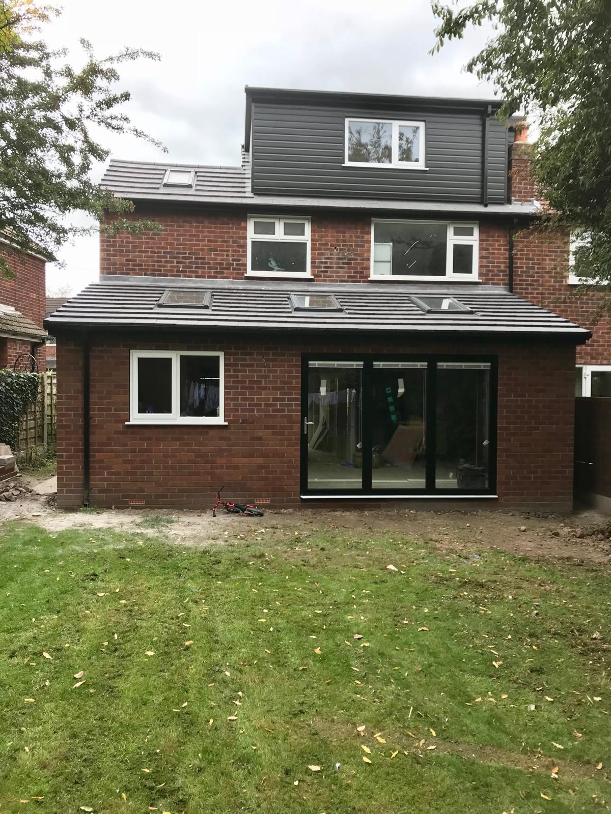 Completed rear extension in Romiley with rooflights and wide glazed doors