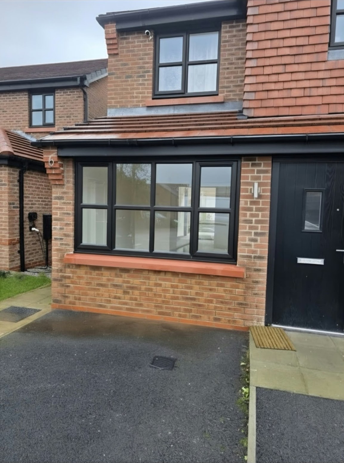 New black-framed window in brickwork at the Worsley garage-to-home-office conversion