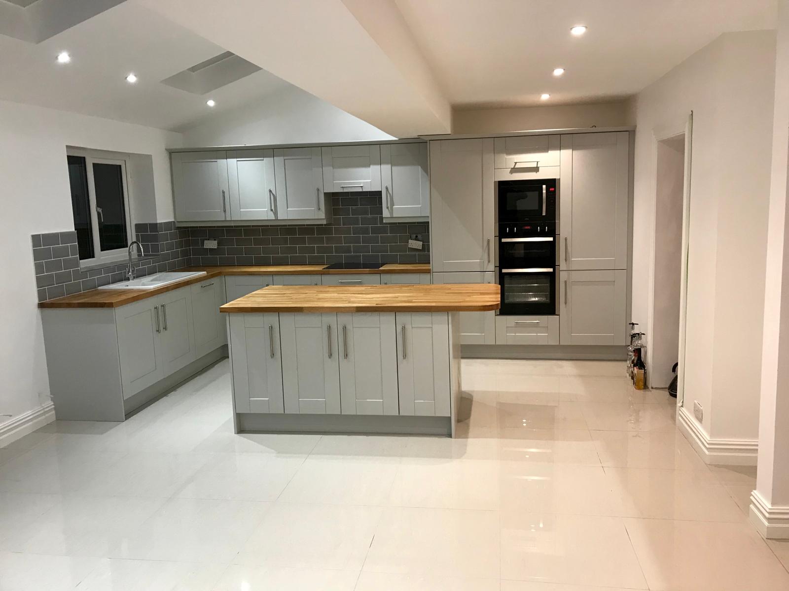 Finished Romiley kitchen extension with island and tiled floor