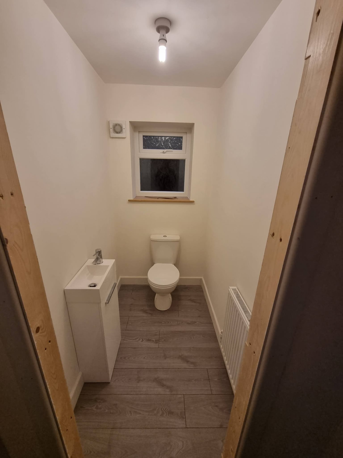 Finished downstairs toilet with washbasin and window