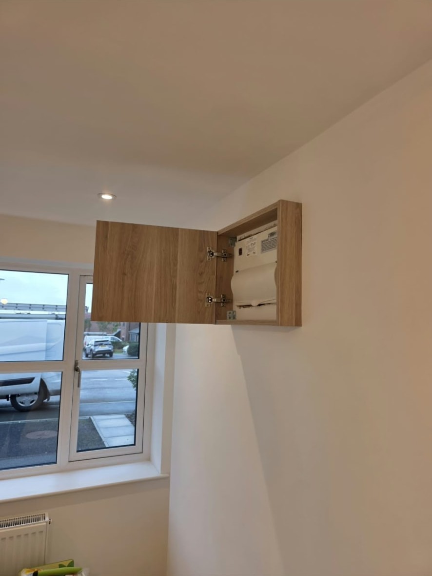 Wall cupboard beside the new window in the Worsley home office