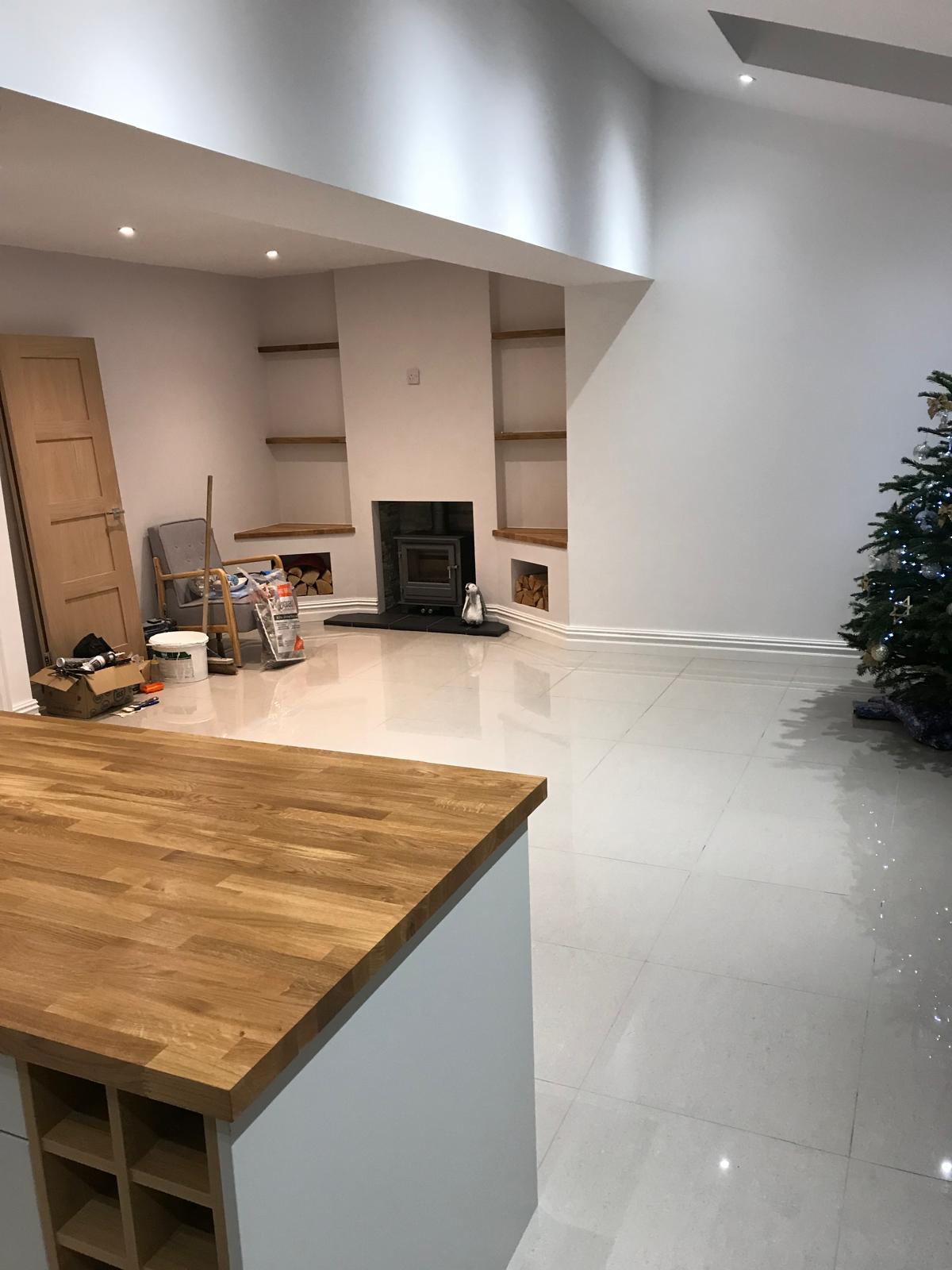 Open-plan Romiley kitchen extension with island and fireplace